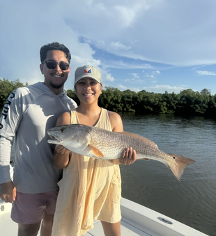 Smiles as big as the Redfish we catch! 